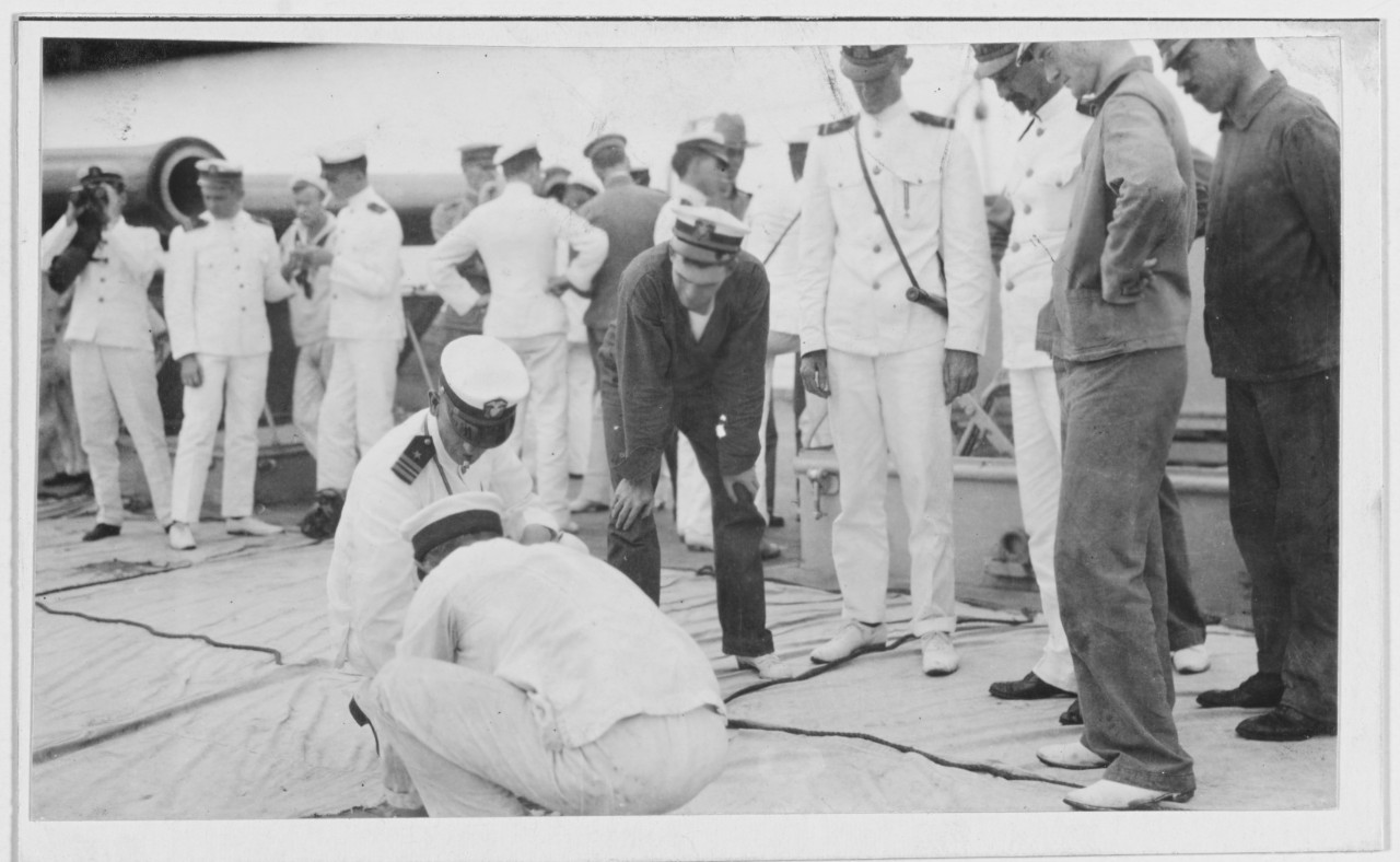 USS FLORIDA. Umpires examining a target for hits. 1914.