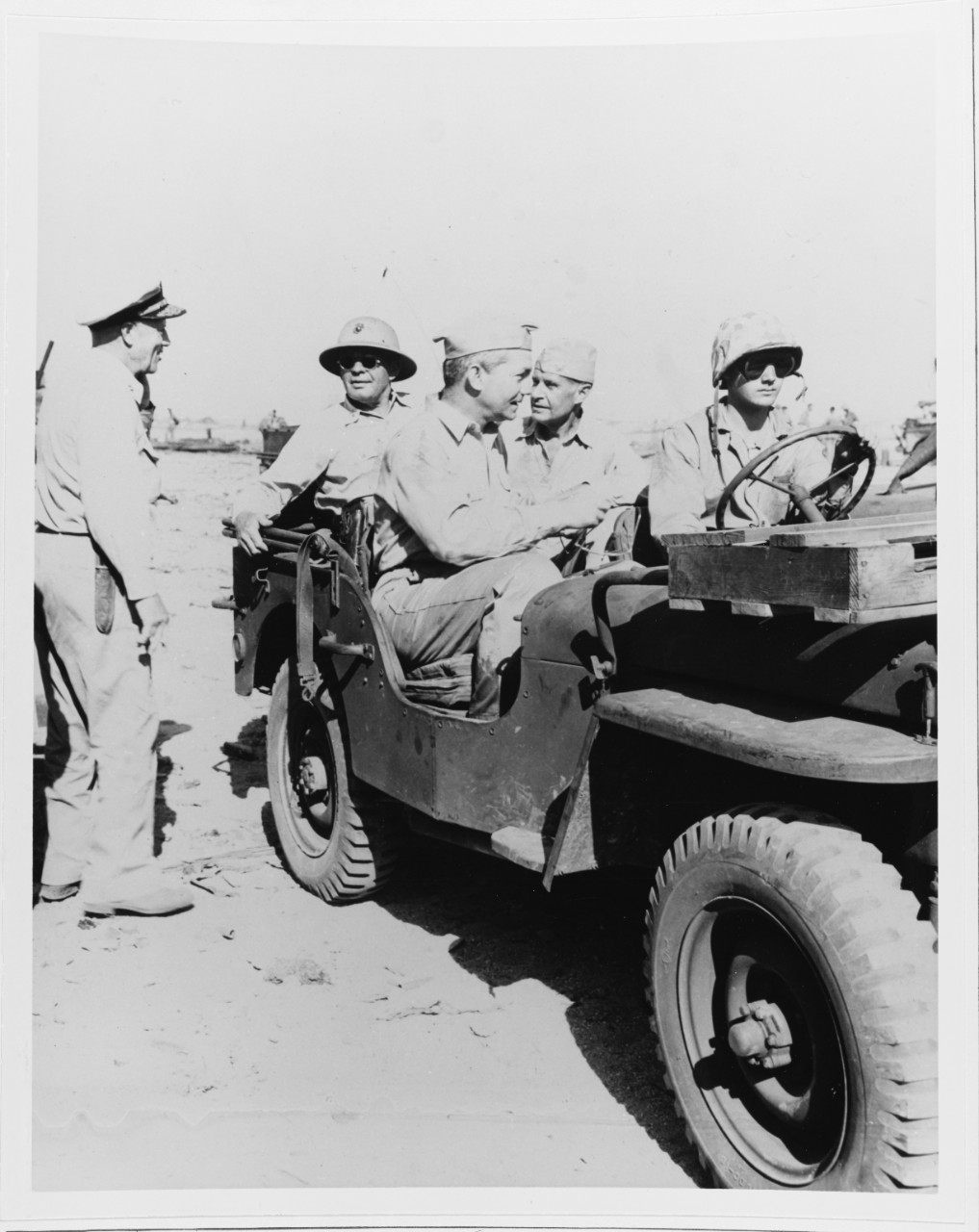 Secretary of the Navy James Forrestal and ADM R.A. Spruance (ComFifthFleet) ride in Jeep, Marshall Islands, 2 Feb. 1944