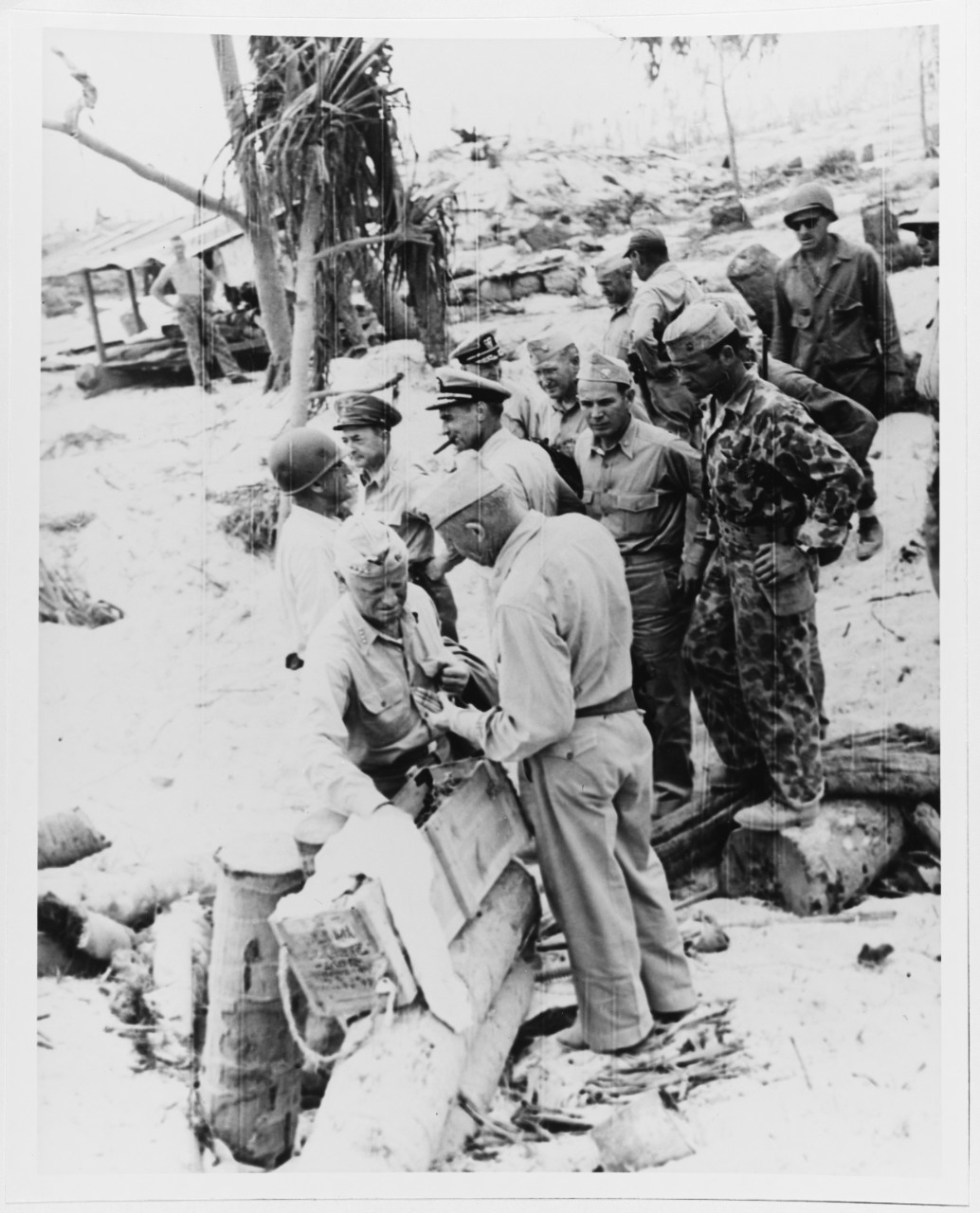 ADM C.W. Nimitz, Cincpac, and men inspect Japanese ammunition on Betio Island, 27 Nov. 1944