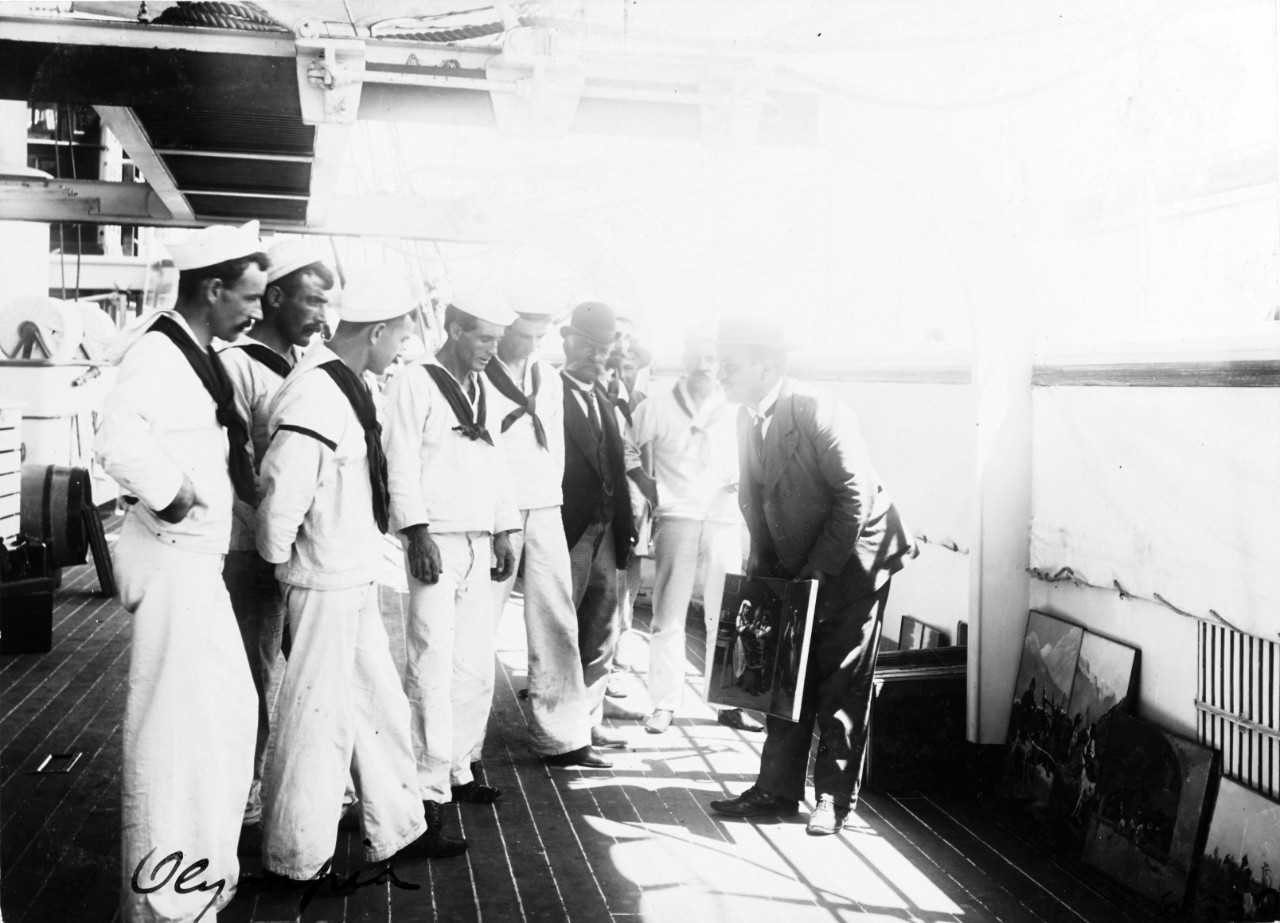 USS OLYMPIA (C-6), peddler selling artwork to crewmen, 1898. 