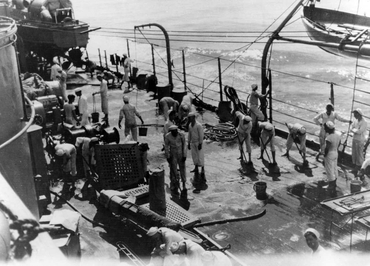 USS Oklahoma (BB-37) - Holystoning the quarter deck, white at sea near Guantanamo Bay, circa 1919. 