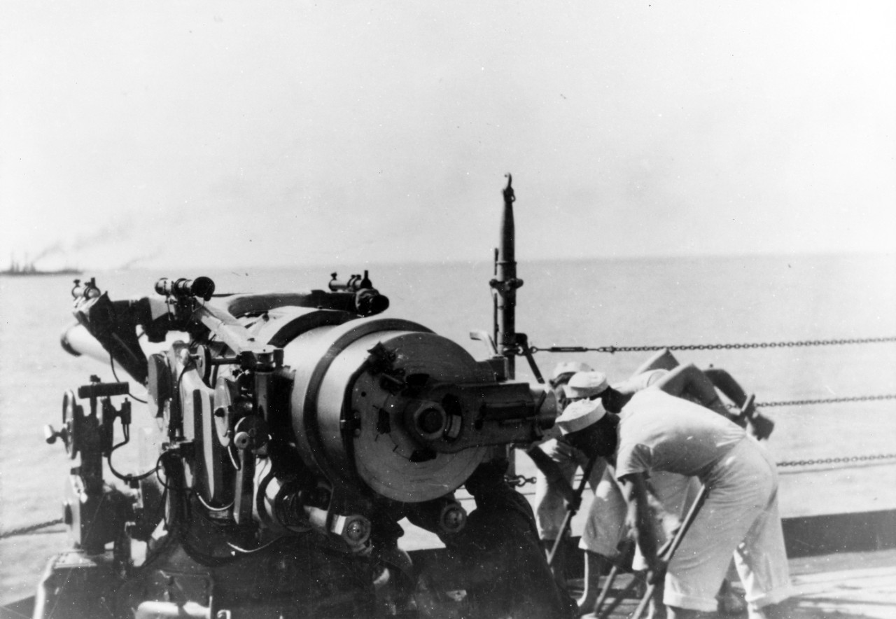 USS Oklahoma (BB-37) - Holystoning the deck, near an open 5"/51 gun, while at sea near Guantanamo Bay, Cuba, circa 1919. 