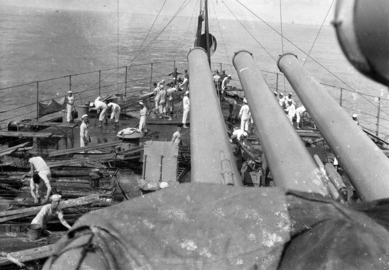 USS Oklahoma (BB-37) - Cleaning (including holy-stoning) the ship for captain's inspection, Guantanamo Bay, Cuba, circa 1919.  