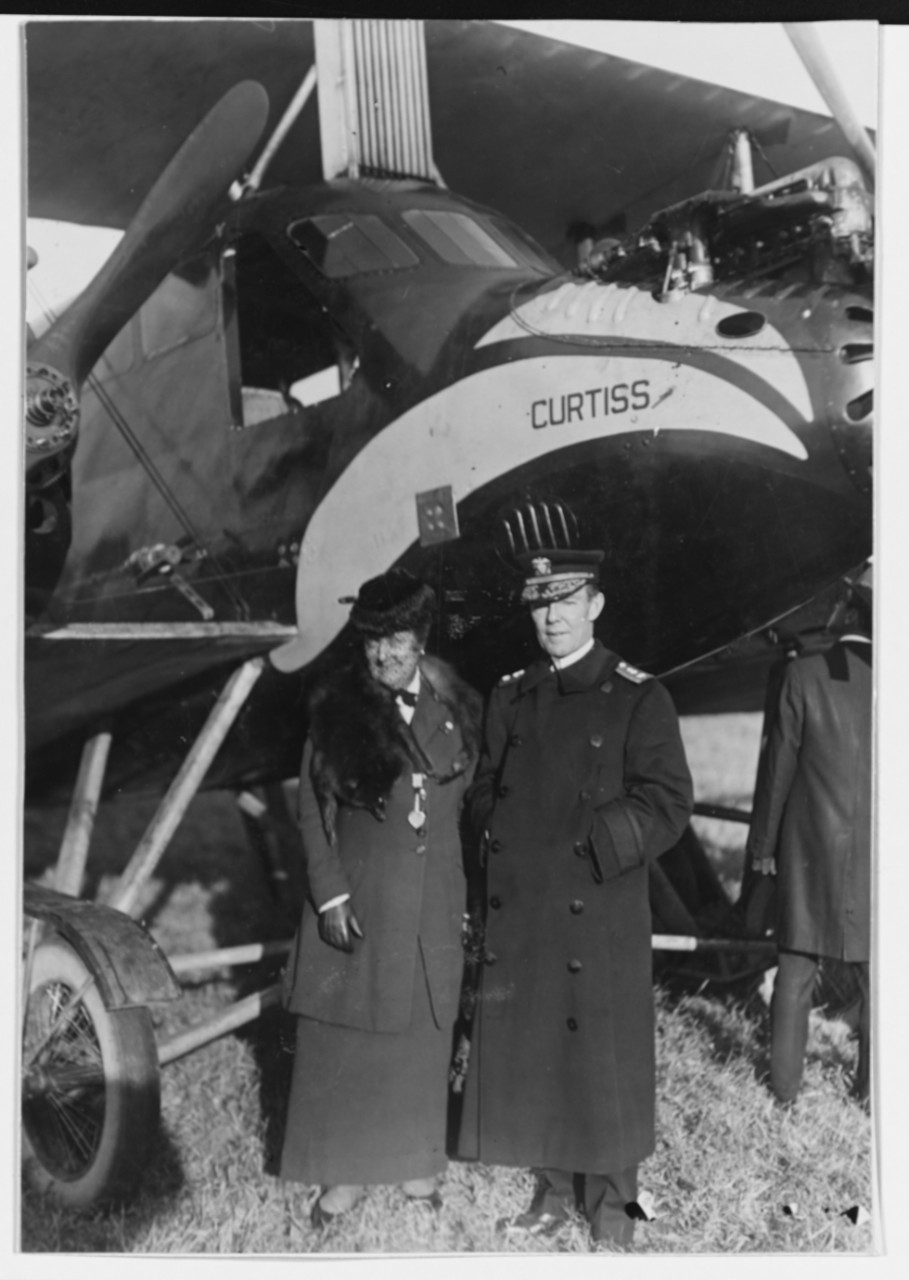 Couple with Curtiss Eagle Plane