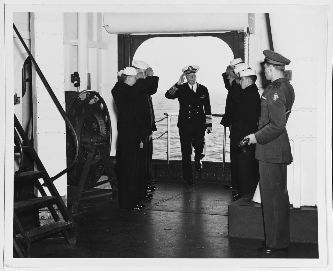 Fleet Admiral Chester W. Nimitz, USN, Chief of Naval operations, is piped on board USS RANDOLPH (CV-15)