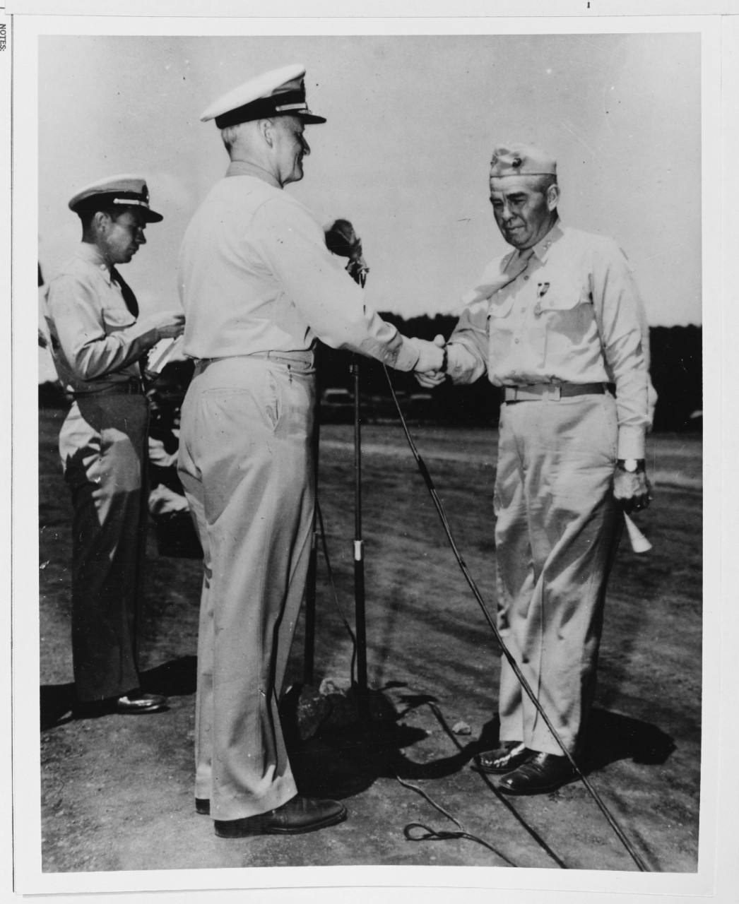 Admiral Chester W. Nimitz (CinCPac) presents the Distinguished Service Medal to MGen. Harry Schmidt, USMC.