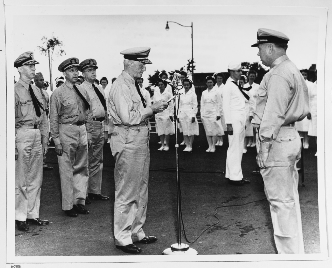 Admiral Chester W. Nimitz (CinCPac-POA) presents the Navy Cross to Lieutenant (jg) D. H. Boyd, USN