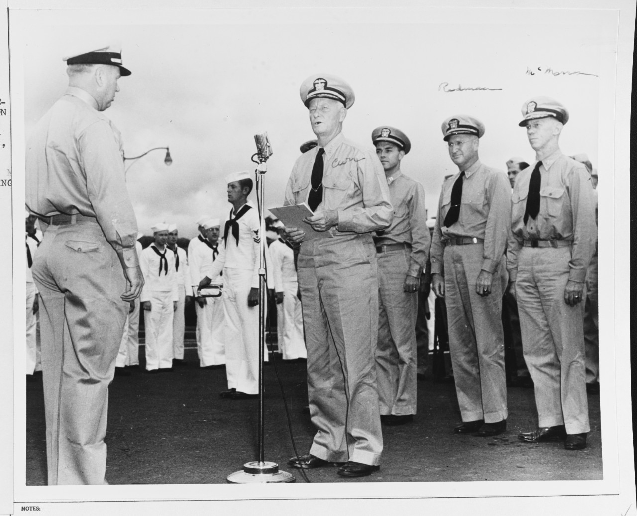 Admiral Chester W. Nimitz (CinCPac-POA) makes a presentation of the Navy Cross to Lieutenant (jg) D. H. Boyd, USN, 1943.