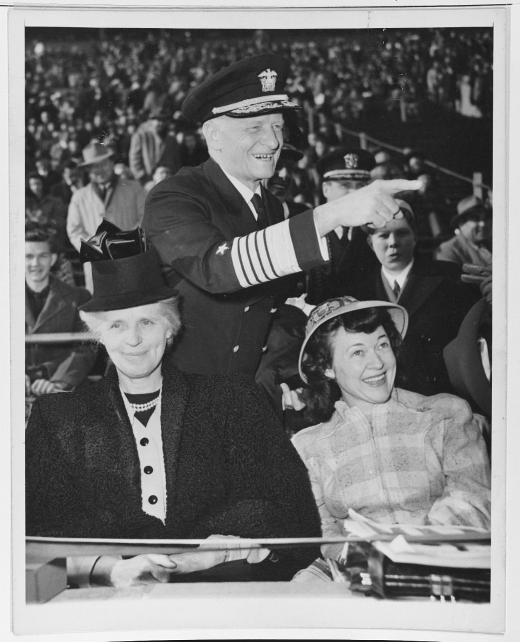 Fleet Admiral Chester W. Nimitz, Chief of Naval Operations, attends a football game.