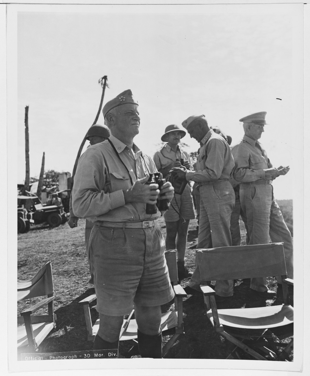 Fleet Admiral Chester W. Nimitz (CinCPac-POA) observes the combat gear and tactics.