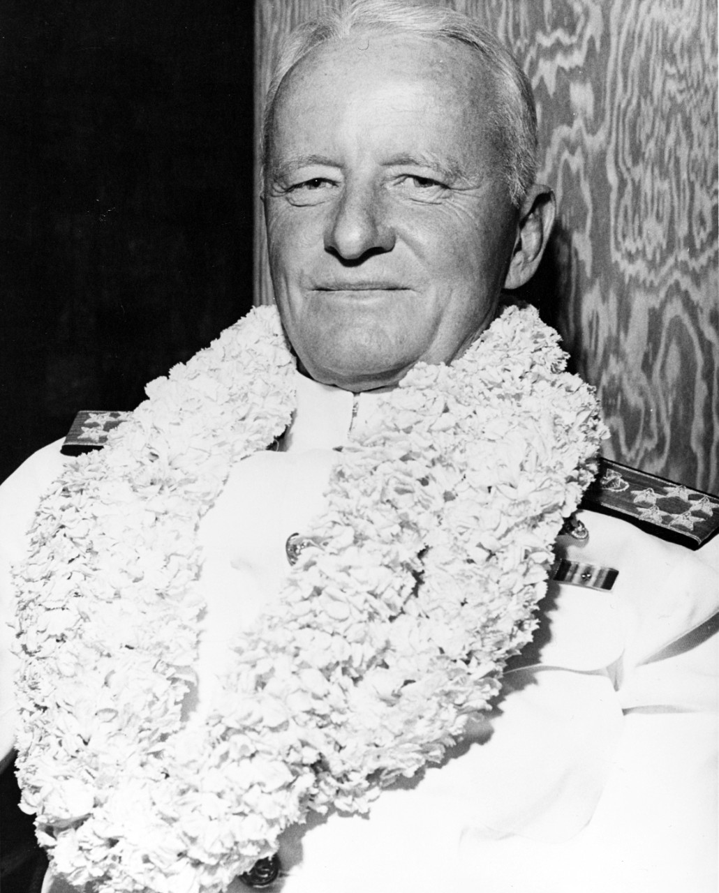Fleet Admiral Chester W. Nimitz, USN, wearing a Hawaiian flower Lei.