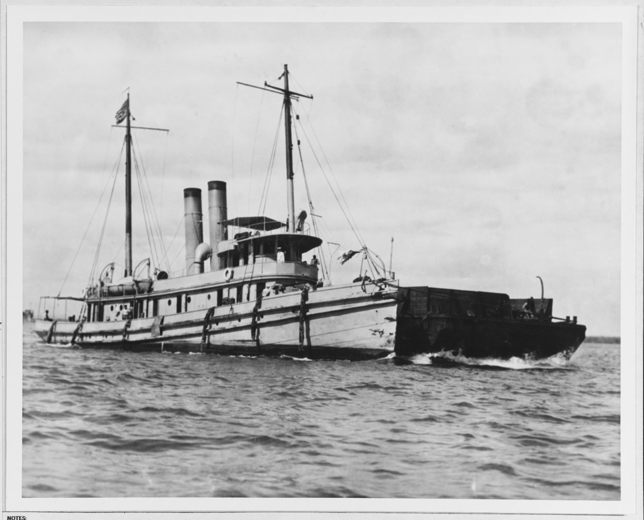 USS OSCEOLA (AT-47), Towing a barge, at Guantanamo Bay, Cuba, in January 1920
