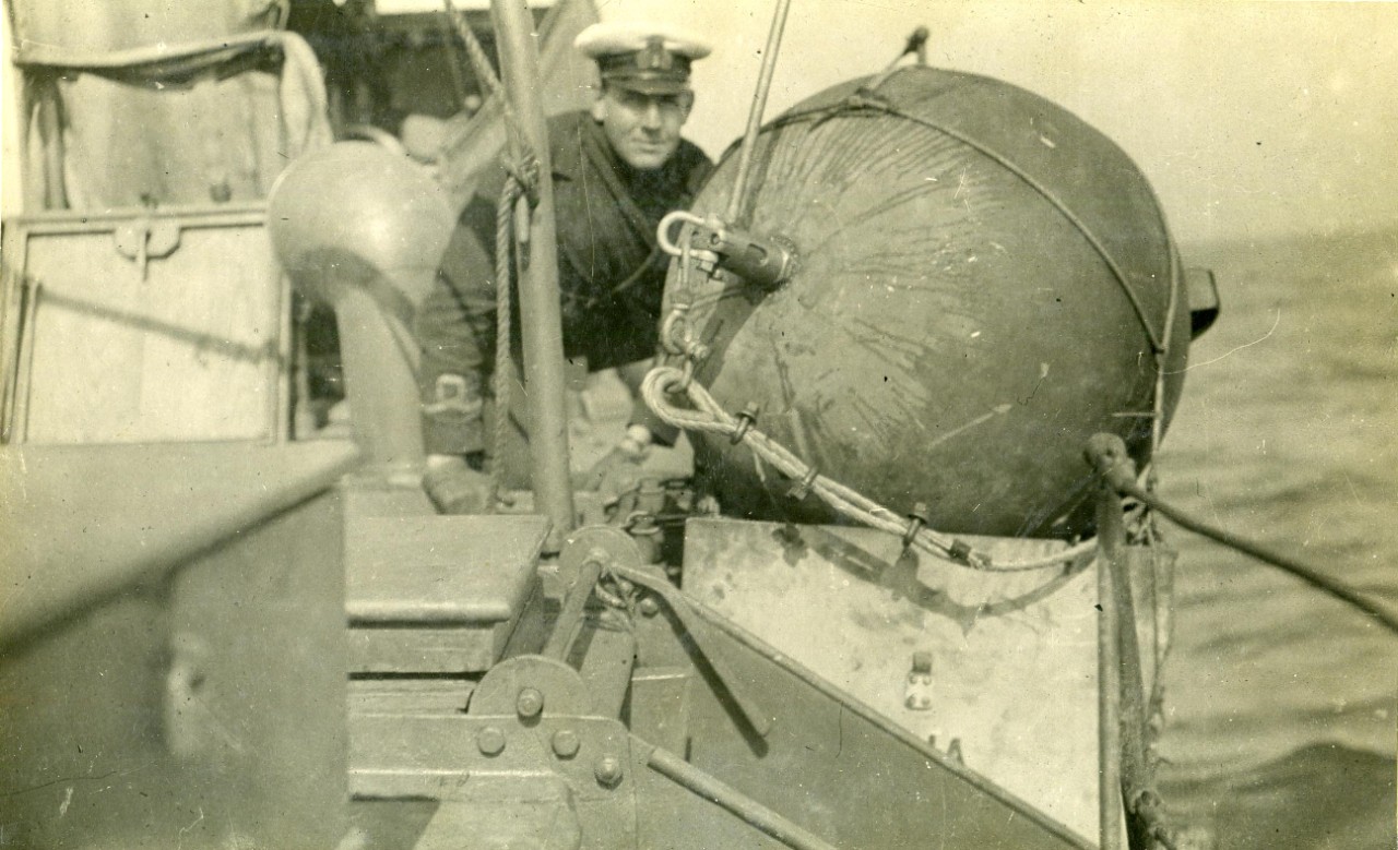 <p>NH 61107: Releasing a mine from a British mine laying motor launch, during World War I. NHHC Photograph Collection.</p>

