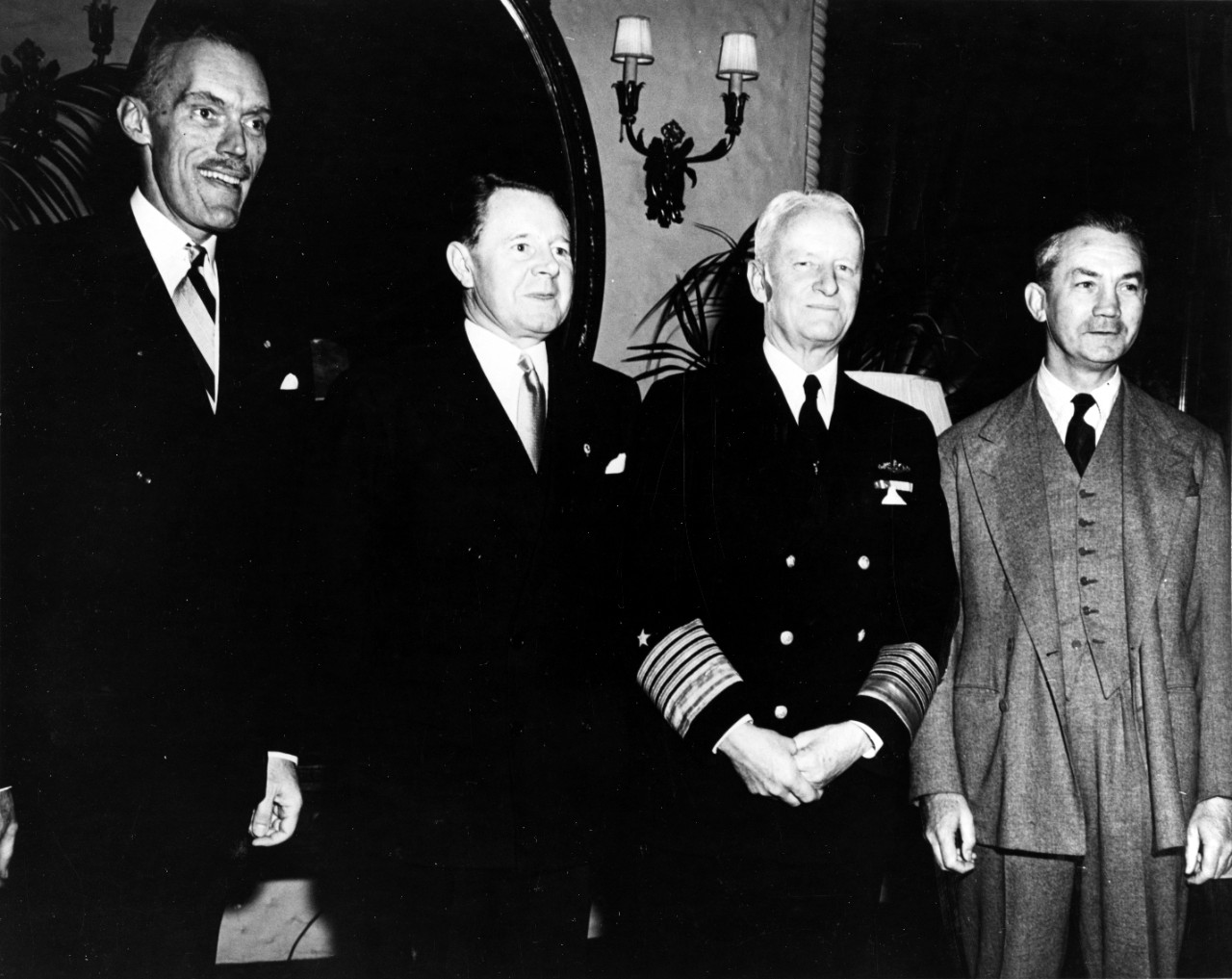 Fleet Admiral Nimitz, Secretary of Navy Sullivan, John Brown, Assistant Secretary Navy for Air, and Secretary of Defense Forrestal
