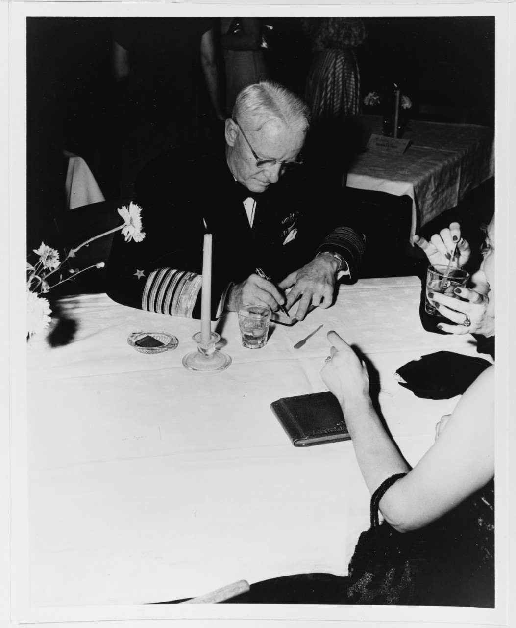 Fleet Admiral Chester W. Nimitz Signs an Autograph