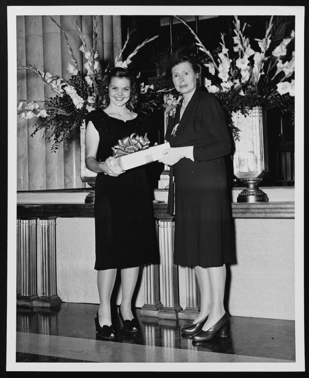 Miss Diane Dealy Presents a Gift to Mrs. Chester W. Nimitz