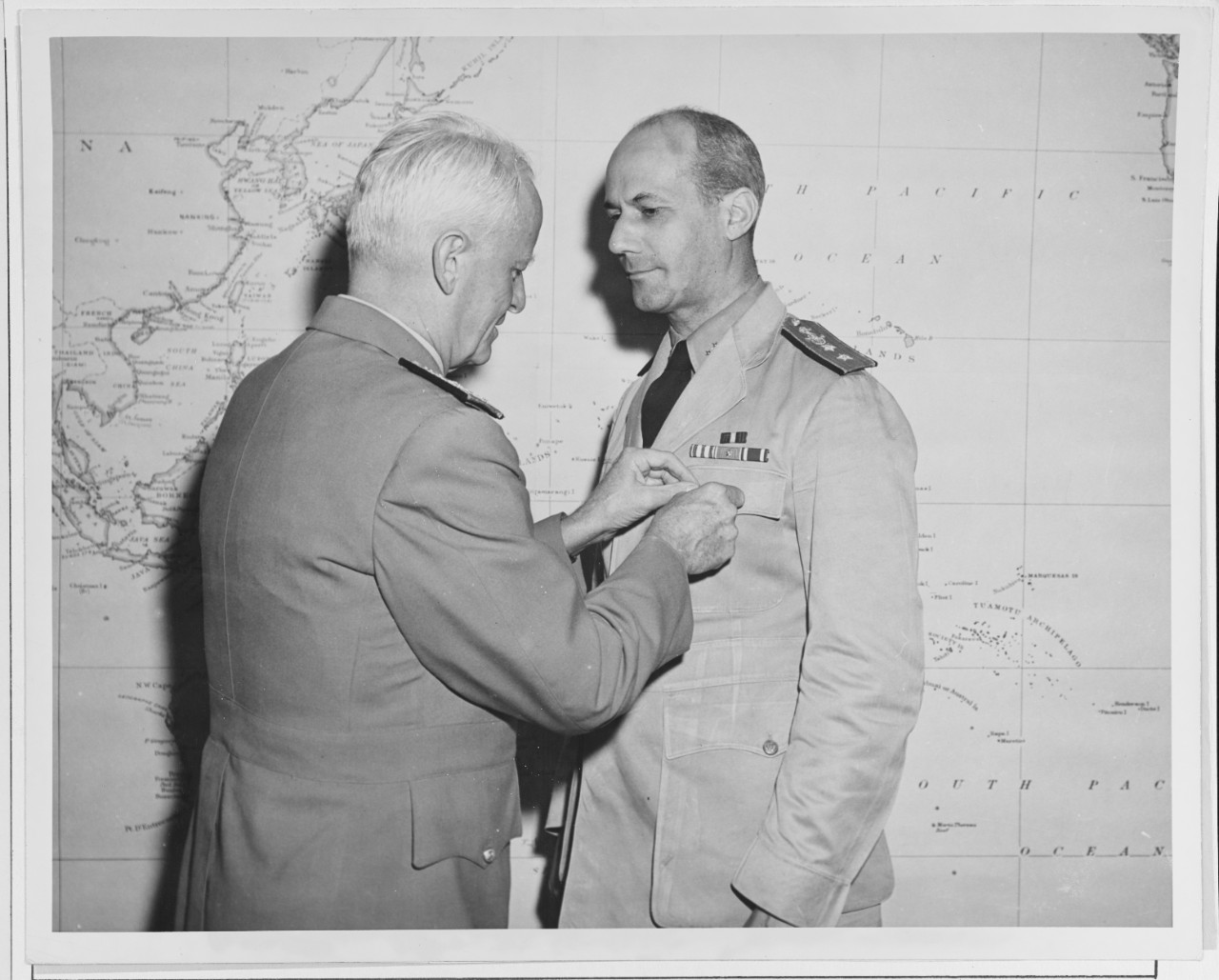 Admiral Chester W. Nimitz Pins the "Loyal Order of Potomac Pollutants" Medal