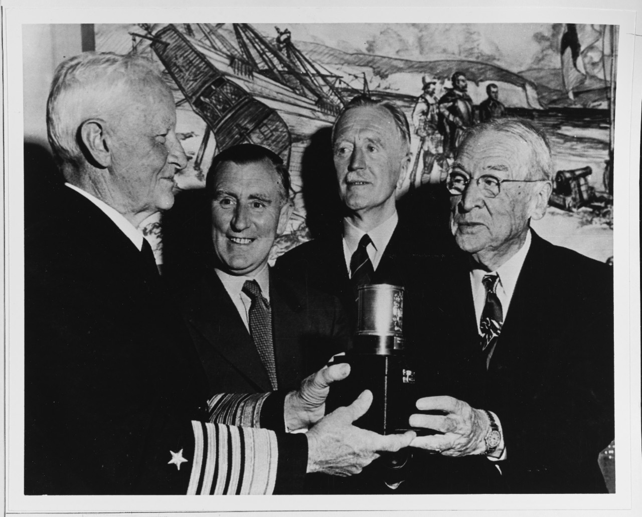 Fleet Admiral Nimitz and Mr. Joseph R. Knowland Hold a Miniature Replica