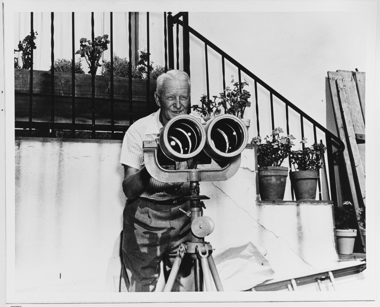 Fleet Admiral Nimitz Poses by his Large Set of Binoculars
