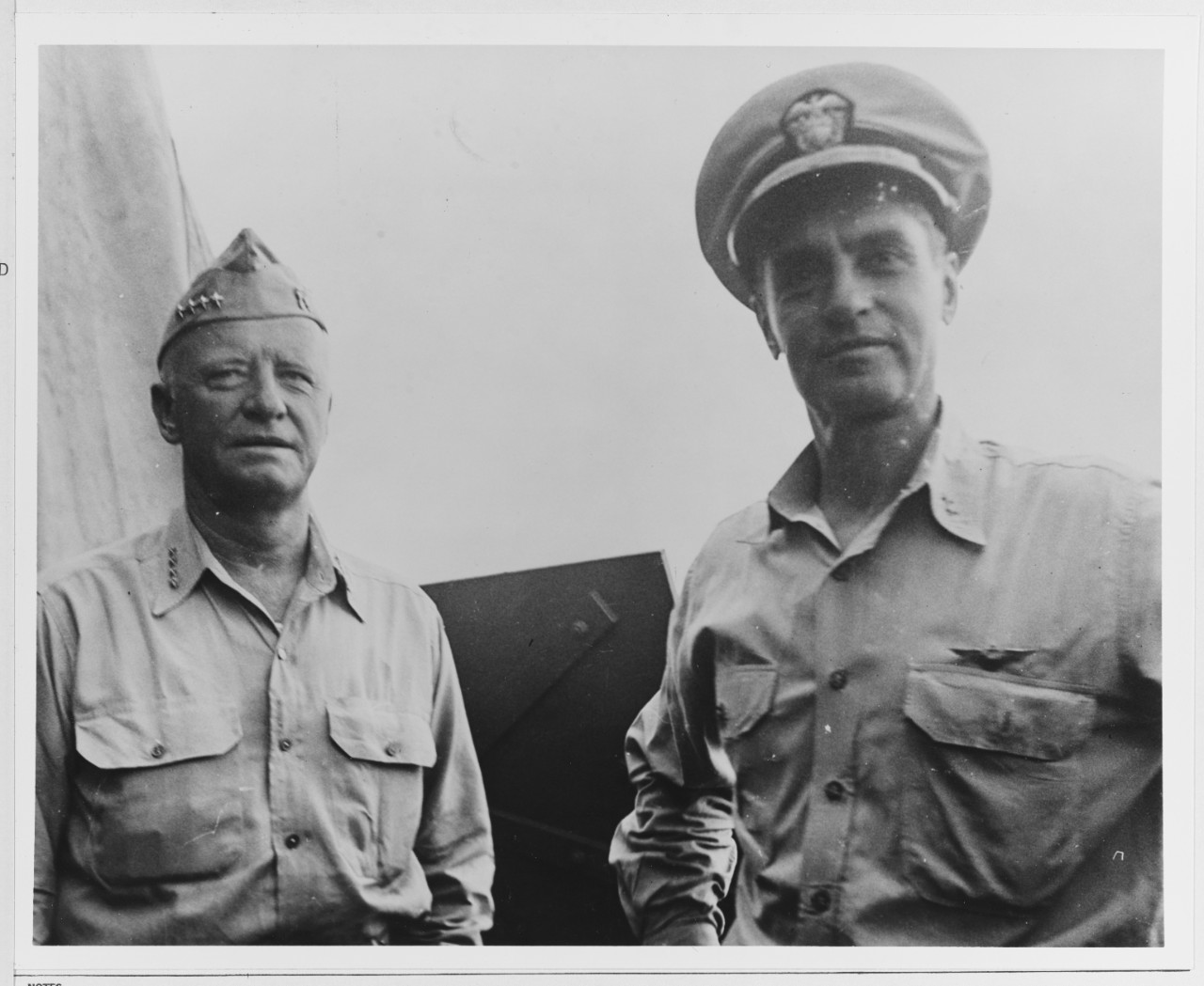 Admiral Nimitz is shown with Rear Admiral Hoover after an inspection of Tarawa