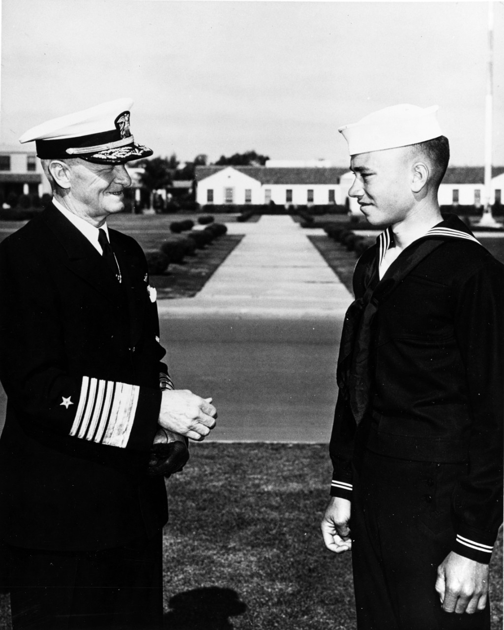 Fleet Admiral Nimitz Offers his Hand to a Young Navy Recruit
