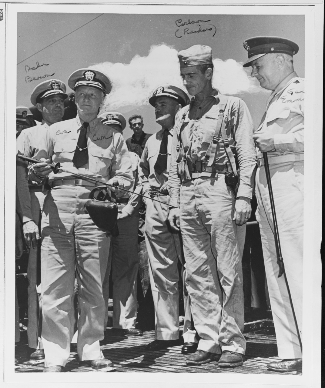 Admiral Nimitz holds Captured Japanese Samurai Weapons