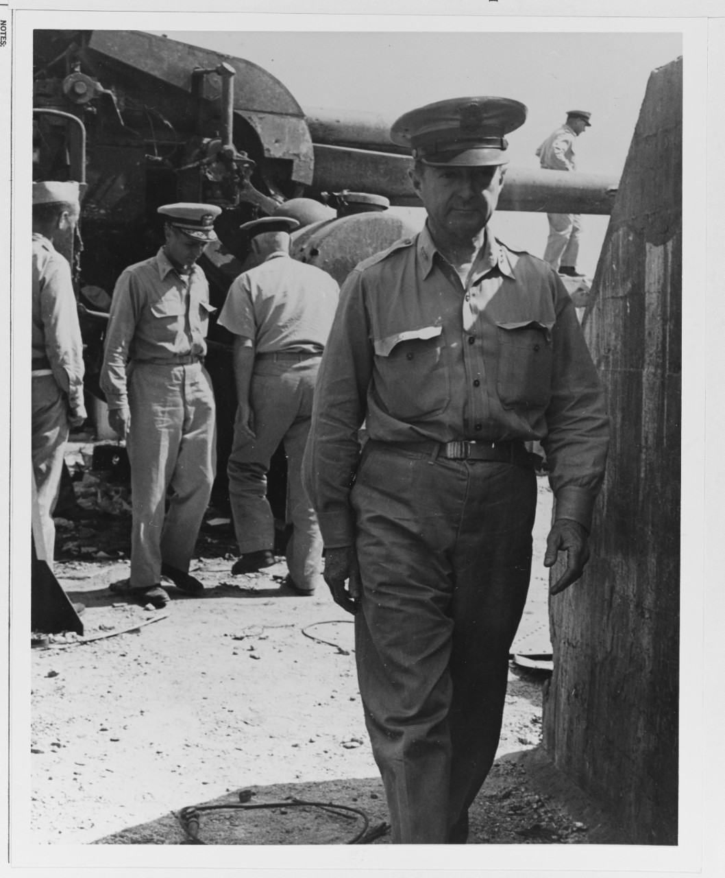 Lieutenant R.C. Richardson, USA, Looks over Damage