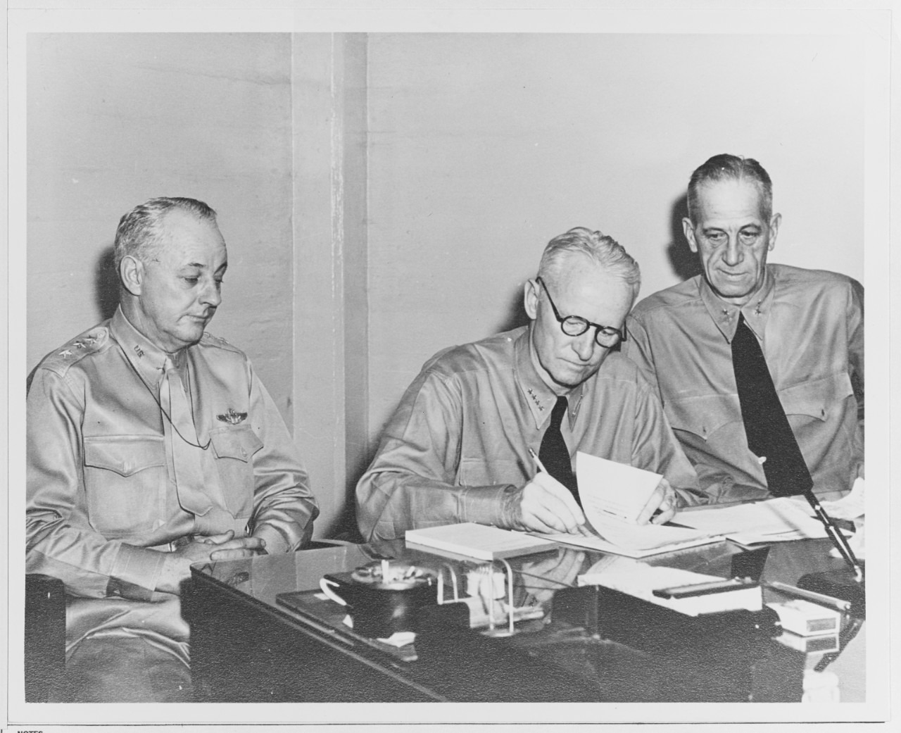 Admiral Nimitz Signs Papers