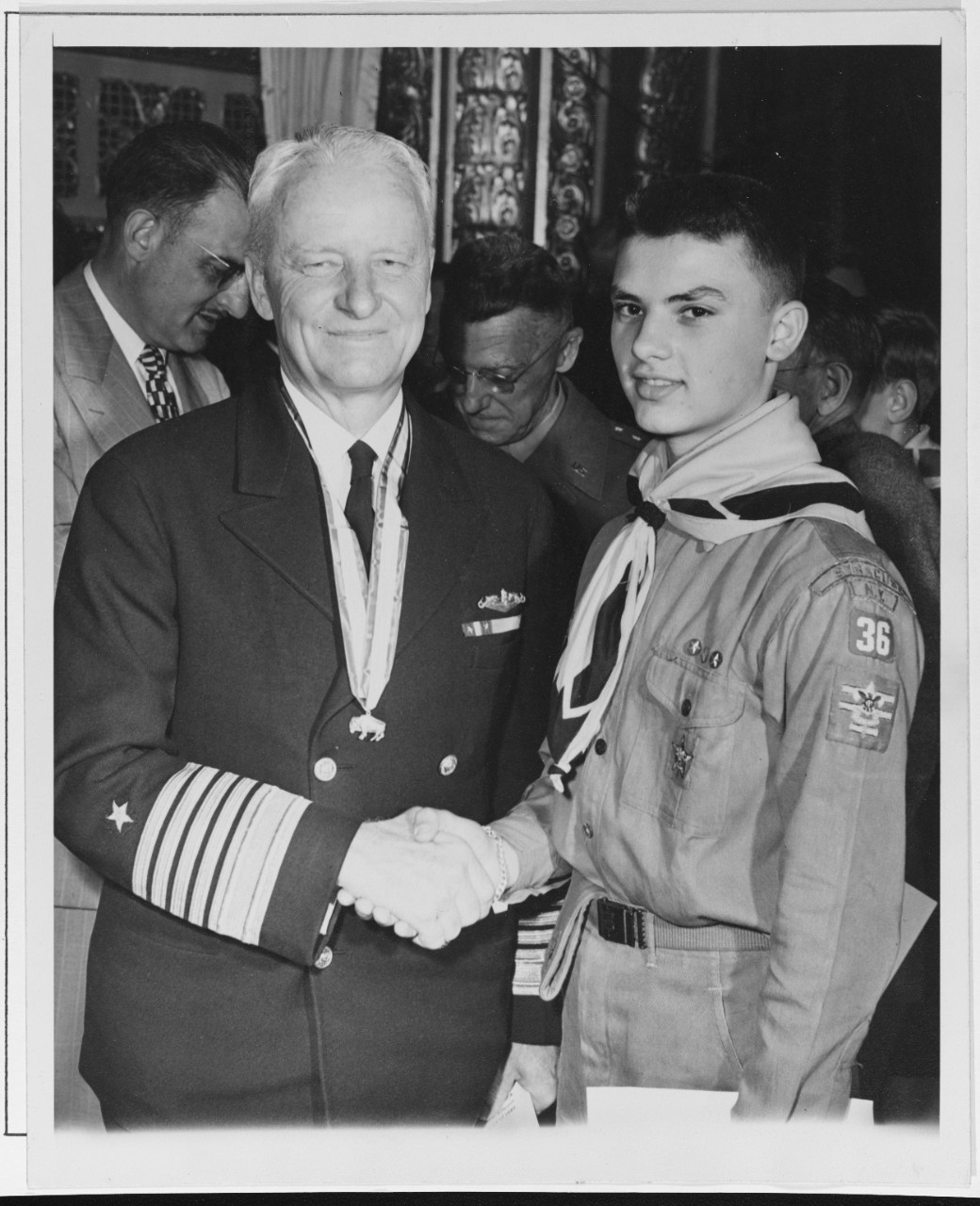 Fleet Admiral Nimitz Shakes Hands with a Star Boy Scout