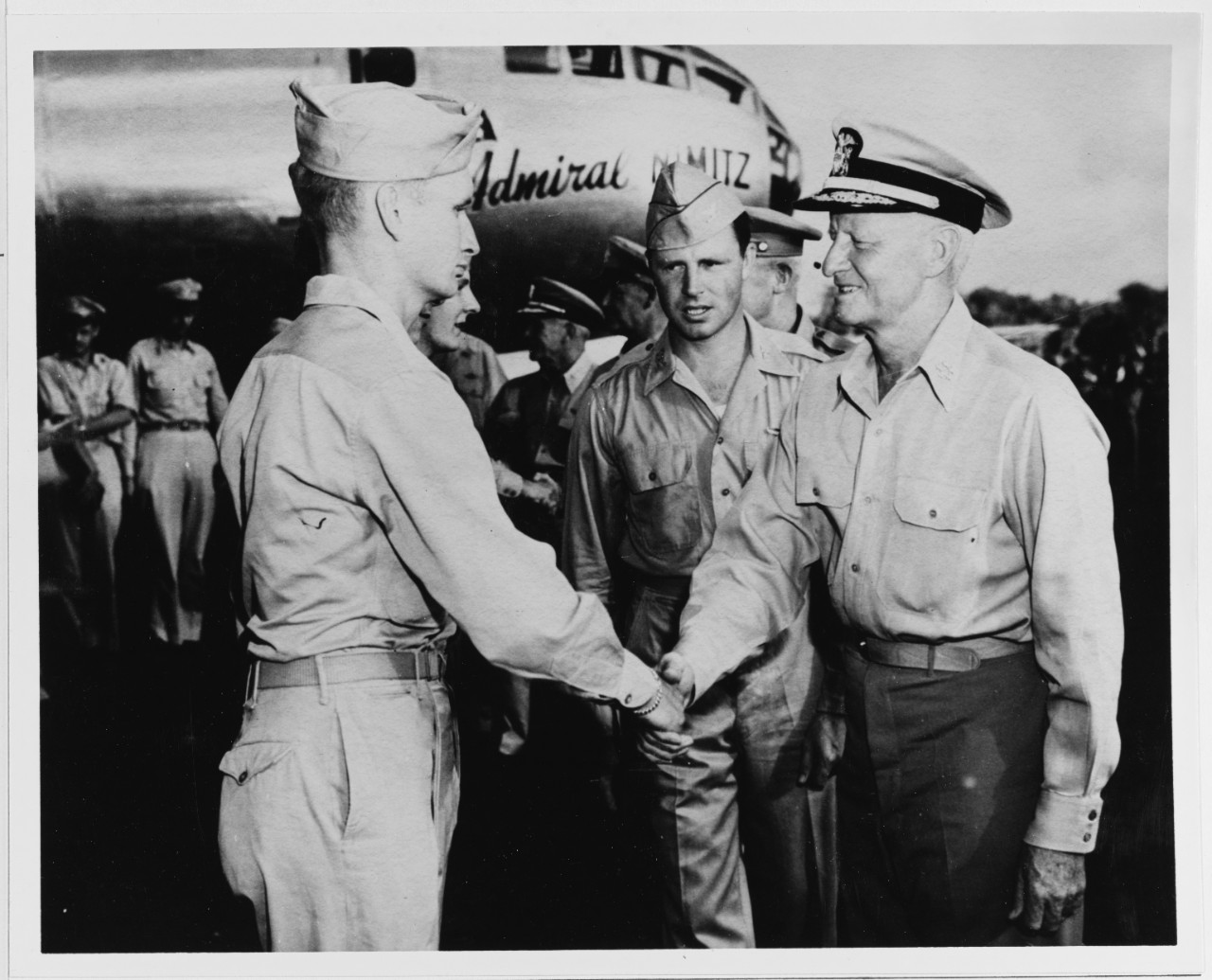 Fleet Admiral Nimitz Shakes Hands with the Crew of a B-29 Superfortress