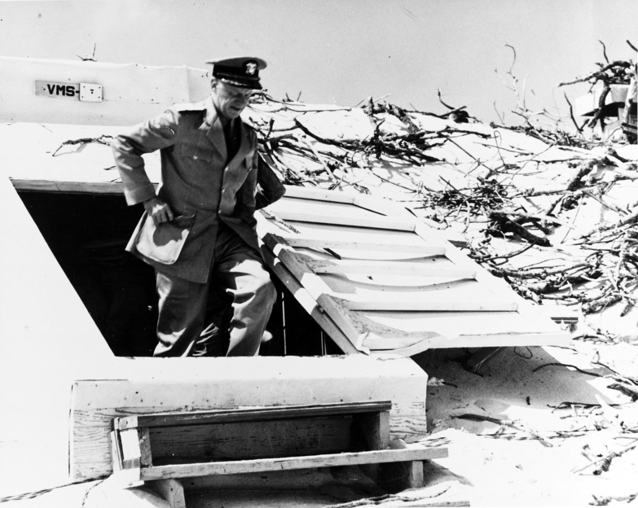 ADM Chester Nimitz inspecting damage