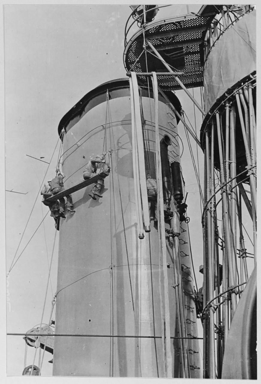 Painting the stacks of a battleship, about 1918.