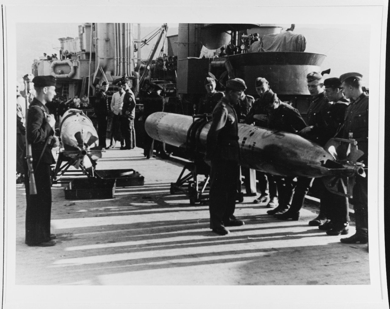 German Troops Examine A Torpedo