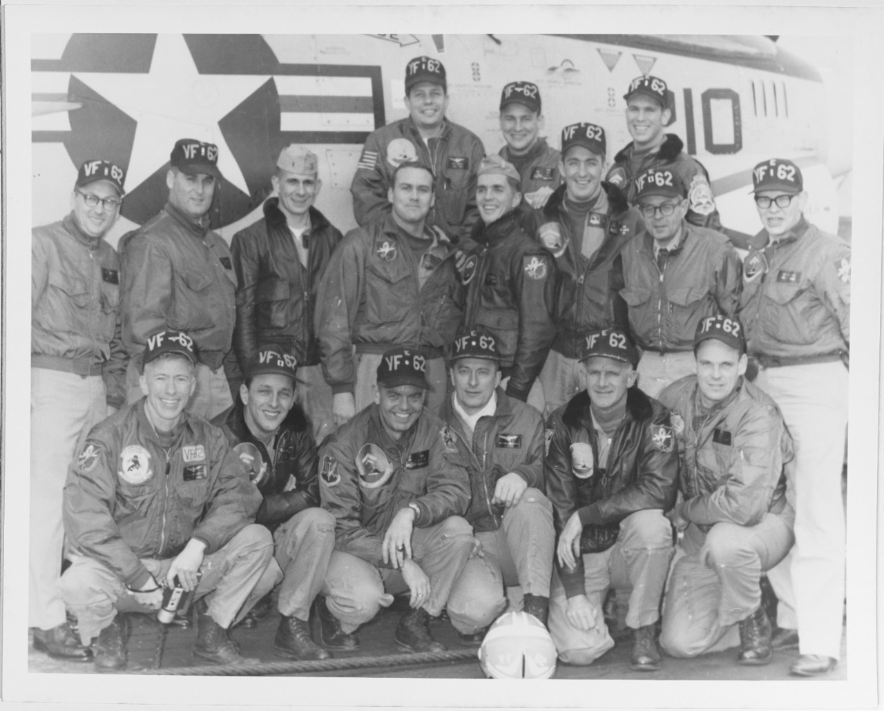 Officers of VF-62 posing in front of an F8U crusader, 13 January 1967.