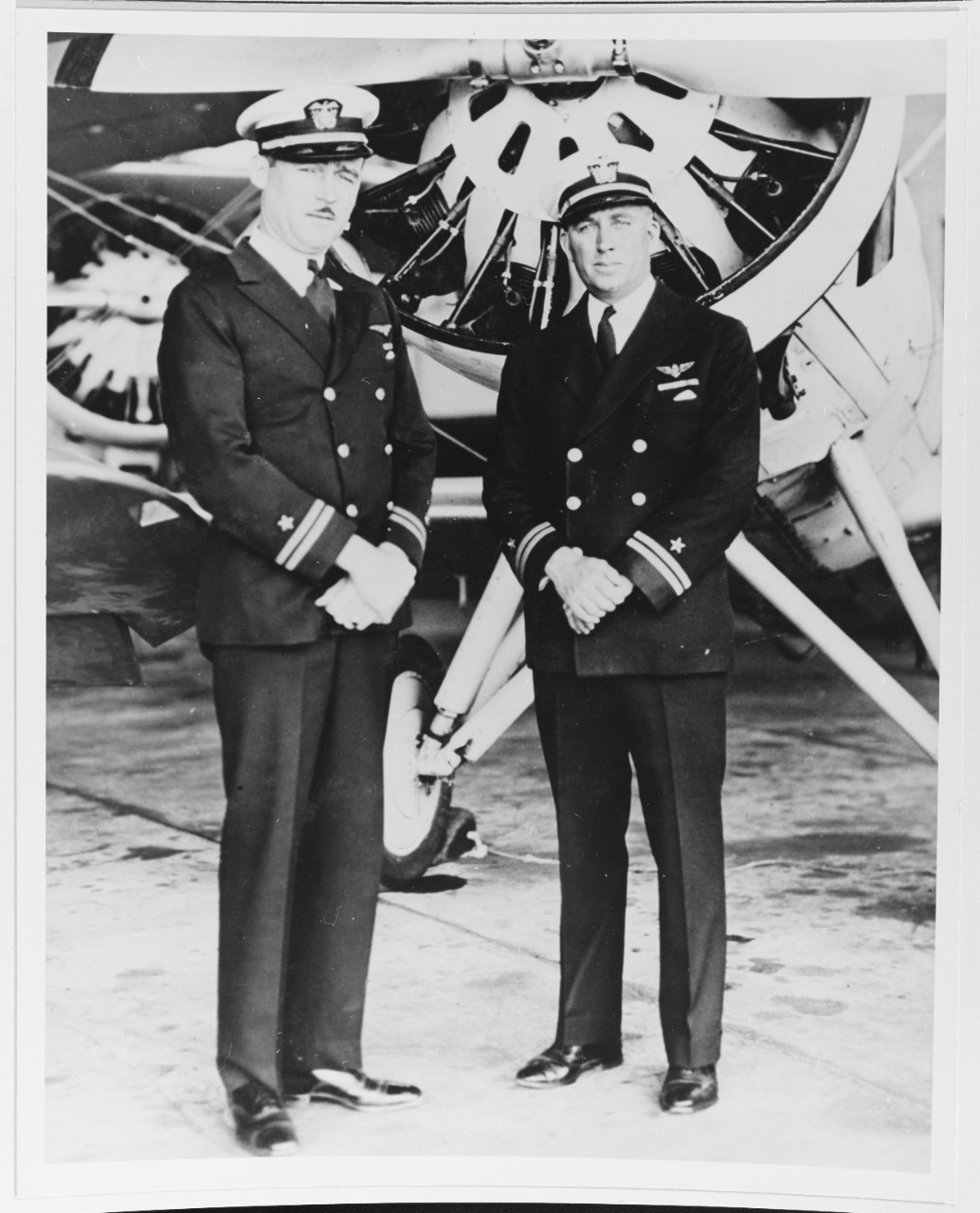 Lieutenant Edwin Francis Conway (left) relieving Lieutenant Whitehead of the command of the Naval Reserve Air Base, Floyd Bennett Field, New York.