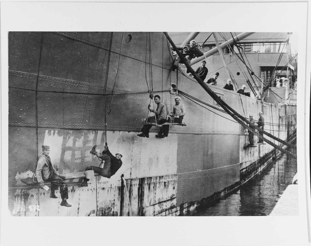 Painting a U.S. Navy auxiliary ship.