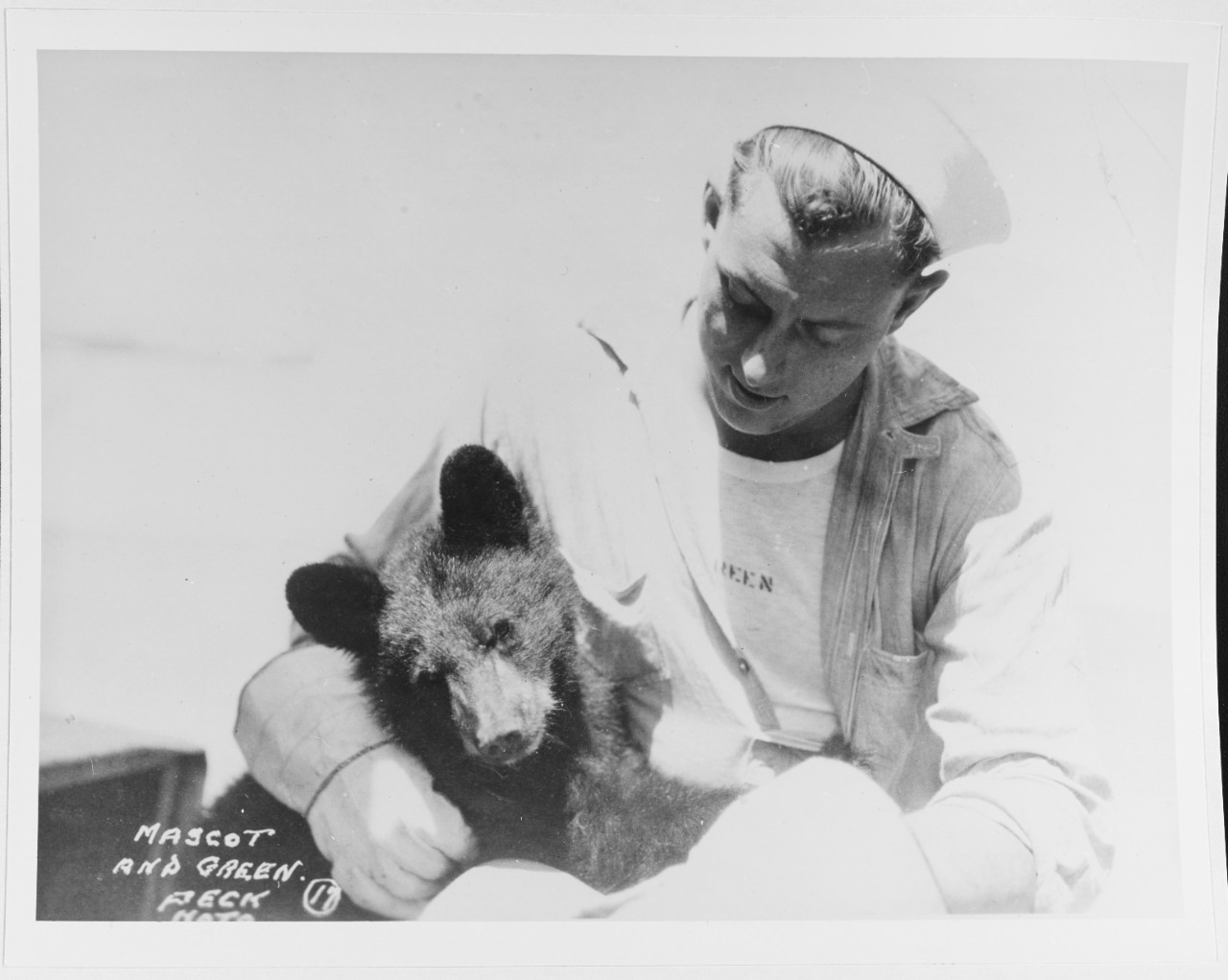 A United States Navy man named Green with a pet bear cub on board