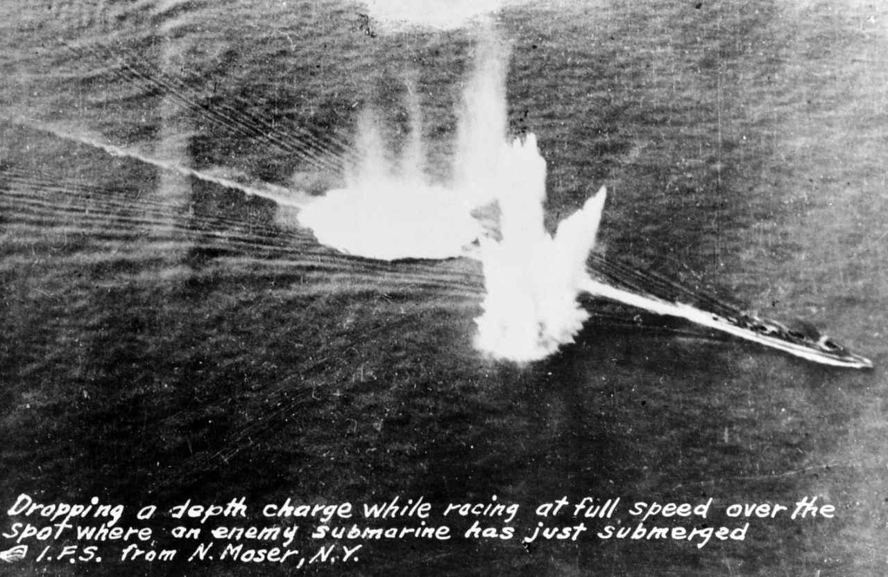 An allied warship dropping depth charges on a U-Boat