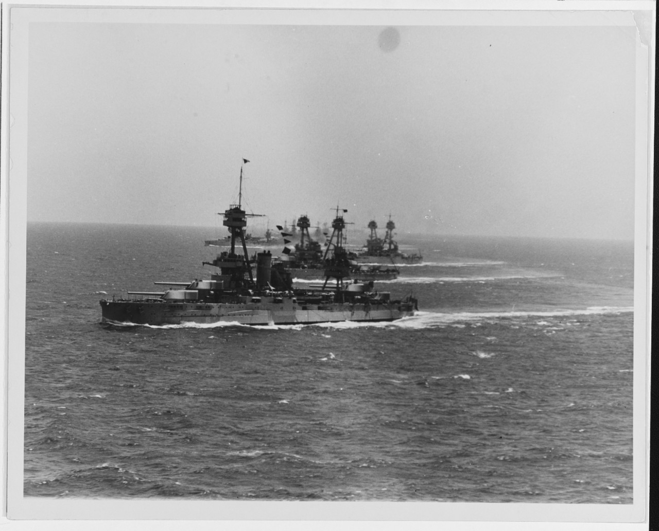 Eight battleships at sea.