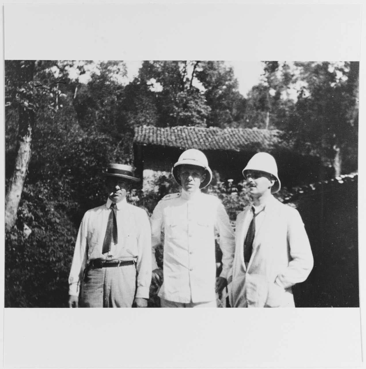 Paymaster William J. Littell, USN (L), Lt. JG Calvin P. Page, USN (center), midshipman Hugo W. Koehler, USN ® at Kuling, China, c. 1912-1914.                           Nicholson Album, NHF -139, p. Naval Historical Foundation, 1976.