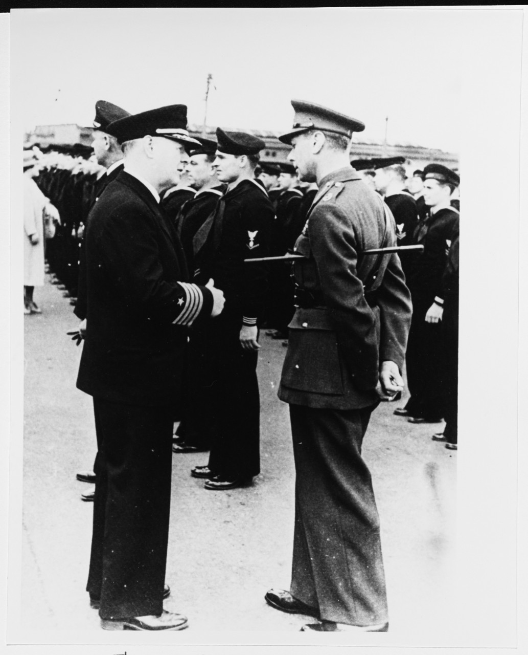 Captain William J. Larson talking with King George VI, of England