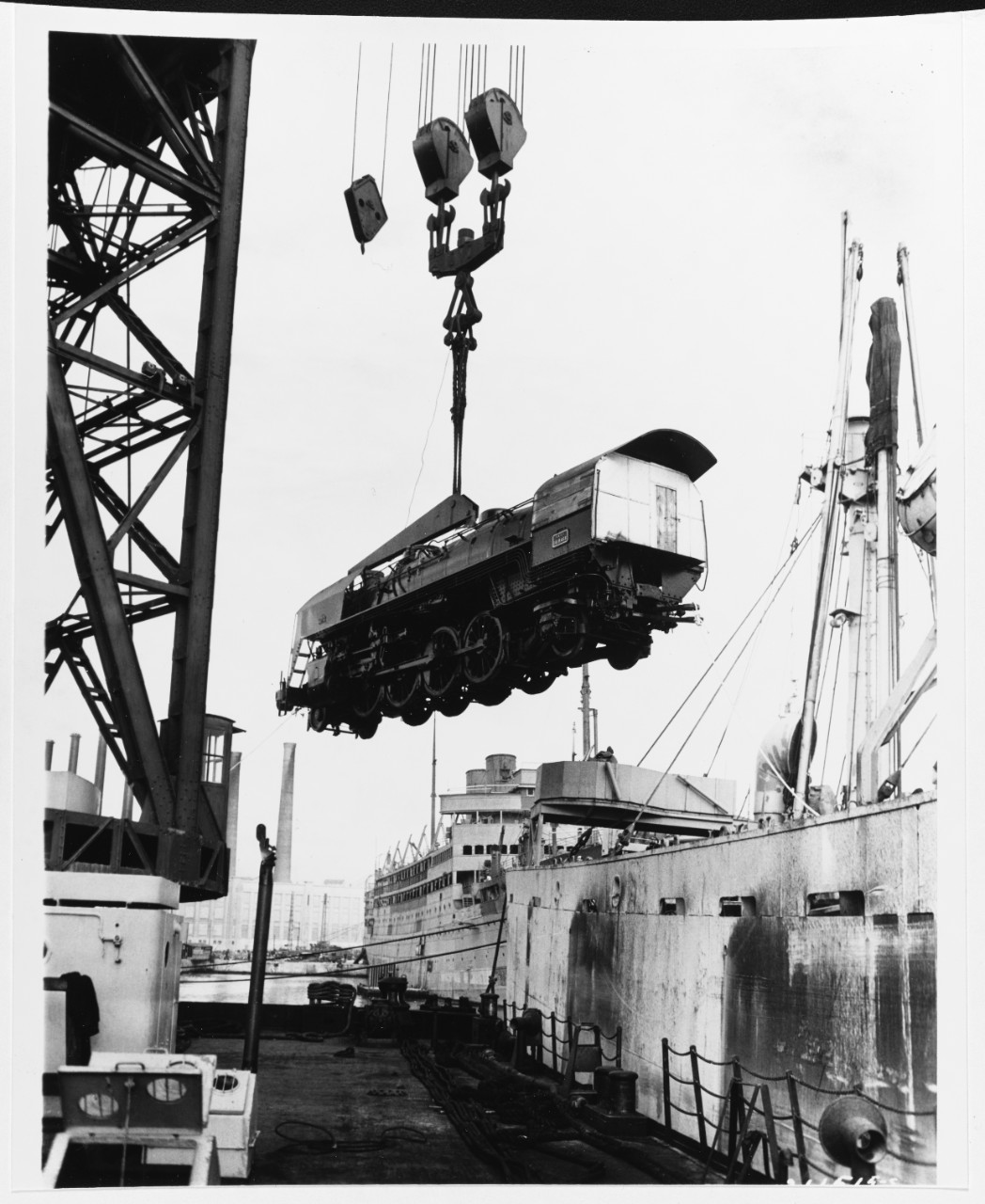 Marseille, France. One of the first U.S. locomotives for the French railroad system is unloaded from the Liberty ship HAROLD O. WILSON, on November 3, 1945