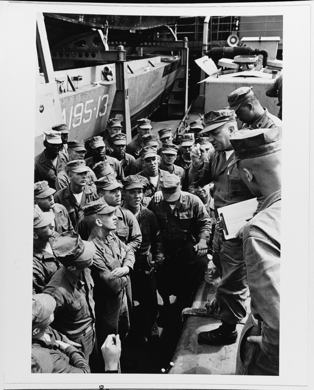 First Sergeant John O. Henry briefs marines of "A" Company, 3rd Battalion