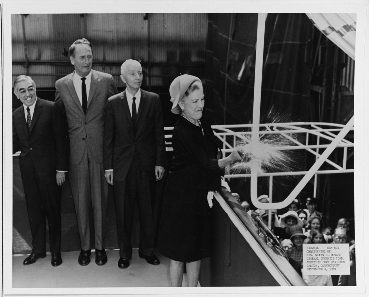 Sponsor Mrs. Glynn R. Donaho christens the USS NARWHAL (SS(N)-671) at Groton, Connecticut.