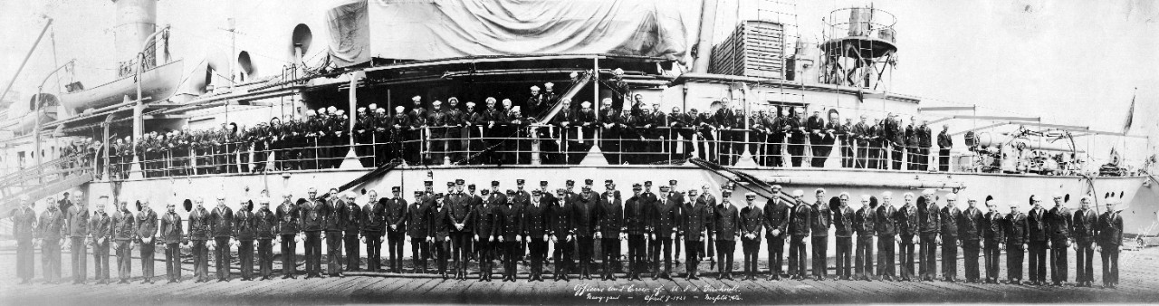 Officers and crew of USS Bushnell (AS-2) on and alongside their ship at Norfolk Navy Yard, VA, 1921.