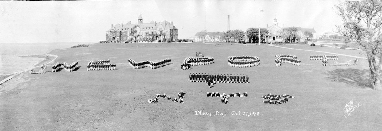 Navy Day Parade, Naval Training Station Newport, RI, 1923. Enlisted men are spelling out "NEWPORT" and "NTS" with their bodies.