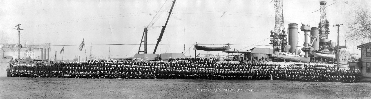 Officers and crew of USS Utah (BB-31) alongside their ship at Norfolk Navy Yard, VA, 1911.