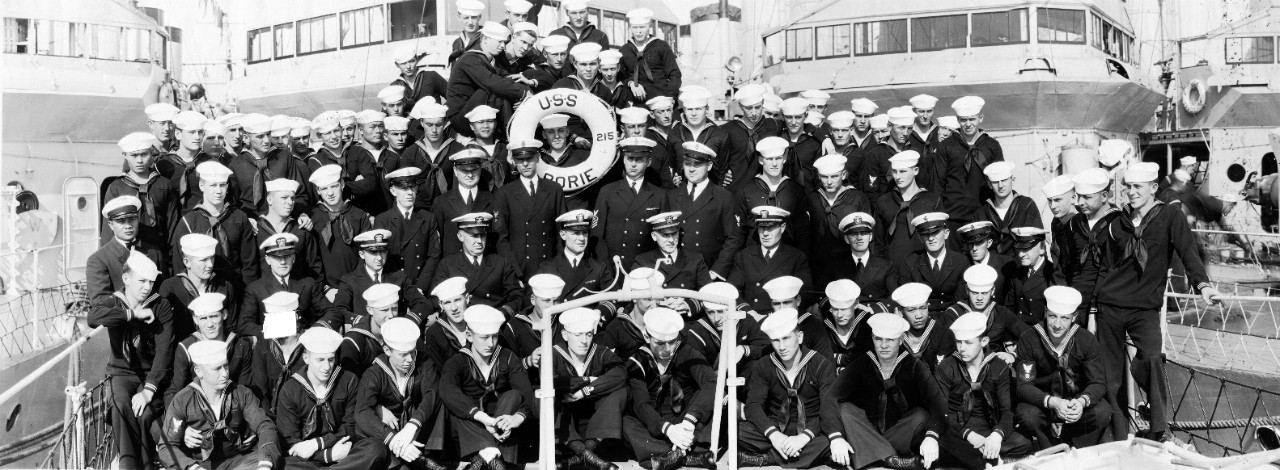 Officers and crew of USS Borie (DD-215) posing on the foredeck of their ship, ca. 1927.