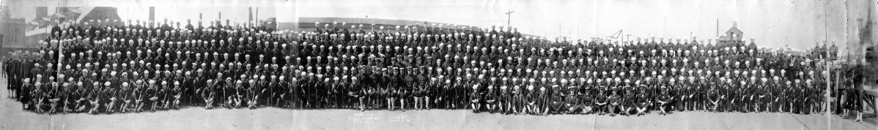 Oversize panoramic photo of Navy officers and men at Federal Rendezvous, 52nd St. Armory, New York City, 1918. Men are posed formally, with front rank holding M1903 "Springfield" rifles. Officers have swords. 