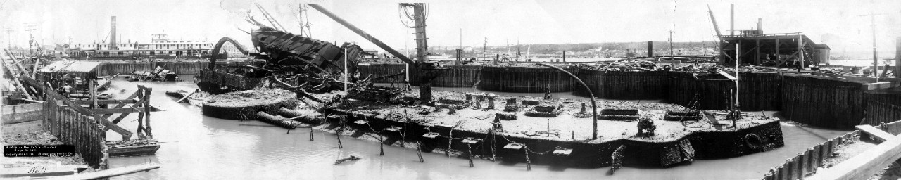Wreck and salvage operation of the USS Maine (ACR-1), view from the port side, looking forward, June 16, 1911. Two different size copies available. Part of a series of eight oversize panoramic photos related to the salvage of the USS Maine. 